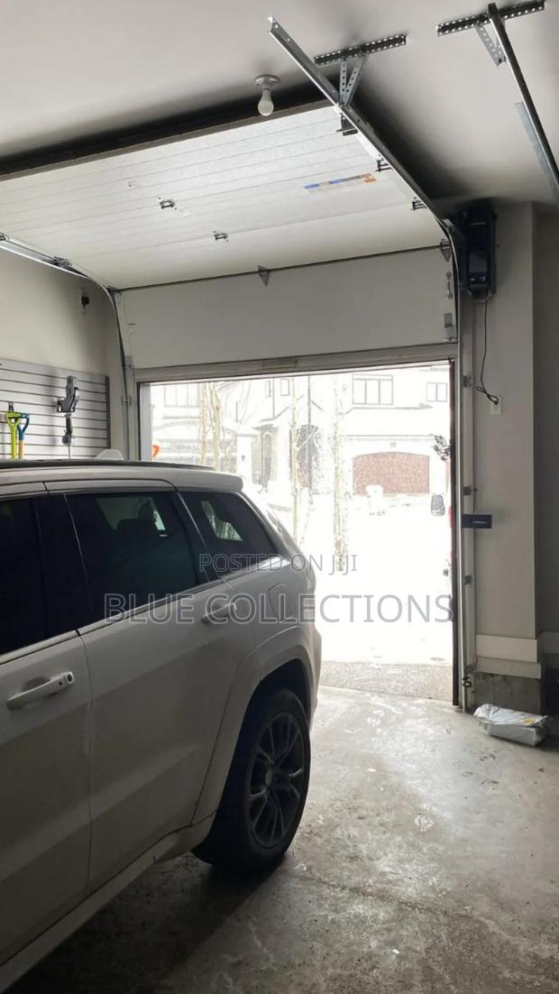 Smart Garage Door With Fanlight · Photo 4