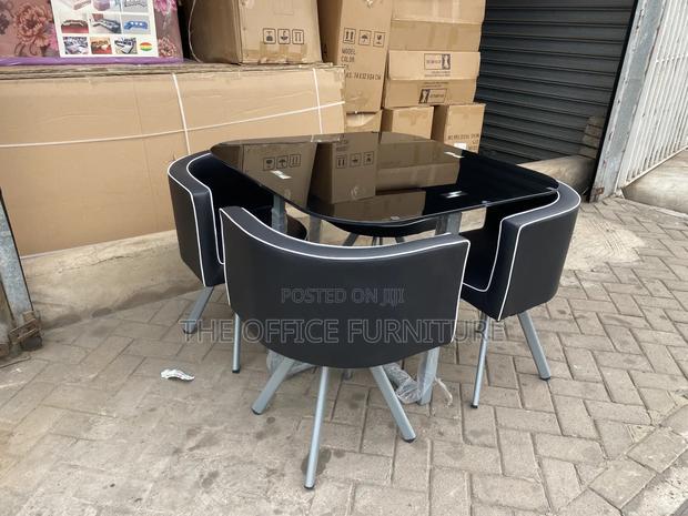 Modern Round Glass Dining Table Set With Four Chairs photo 2