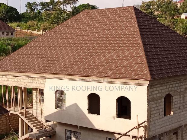 Brown Colored Shingle Roofing Tiles · Photo 2