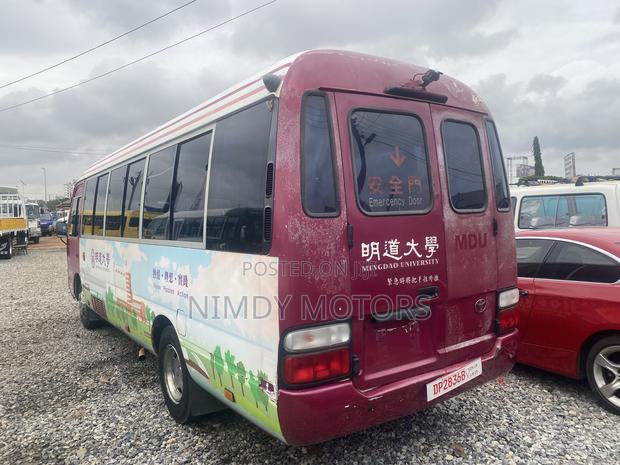 Toyota Coaster 2015 Beige photo 4
