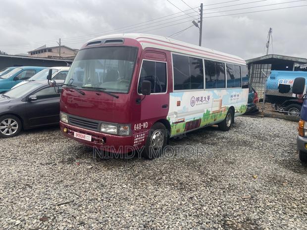 Toyota Coaster 2015 Beige photo 2
