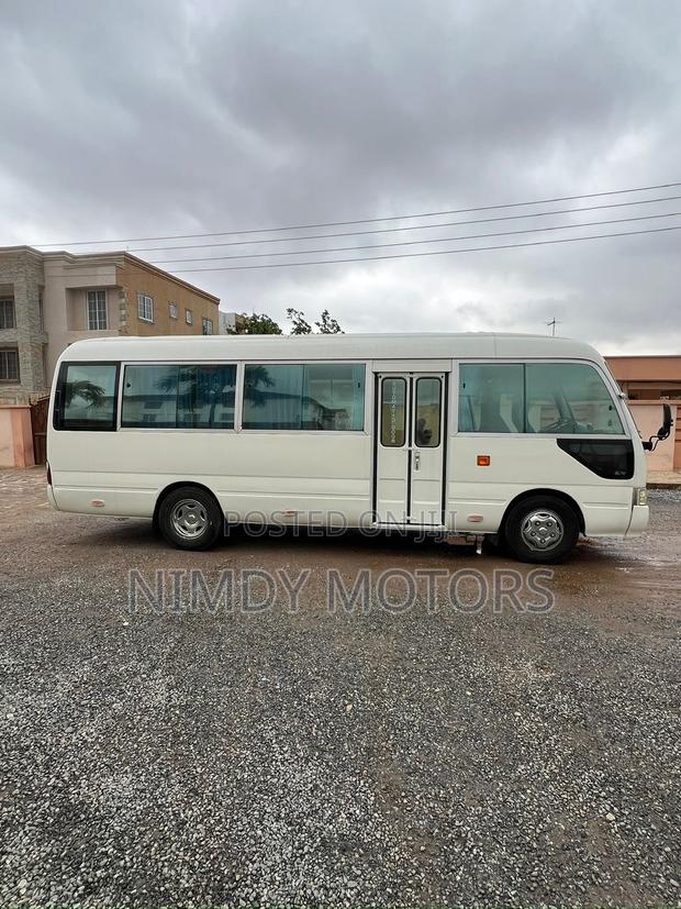 Toyota Coaster 2013 White photo 2
