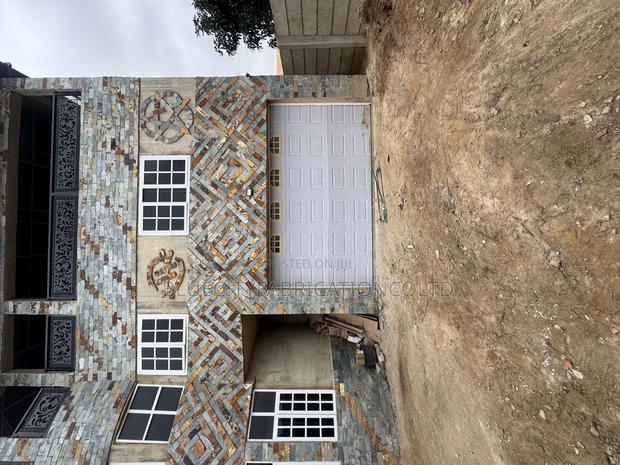 Sectional Garage Doors With Fanlight and Automated Motor