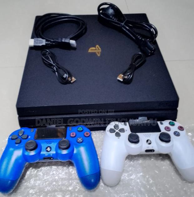 Uk Used Ps4 Pro 1terabyte, With 2 Controllers and 12 Games. · Photo 1