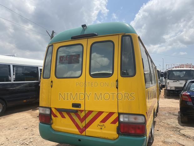 Toyota Coaster 2014 Yellow photo 3