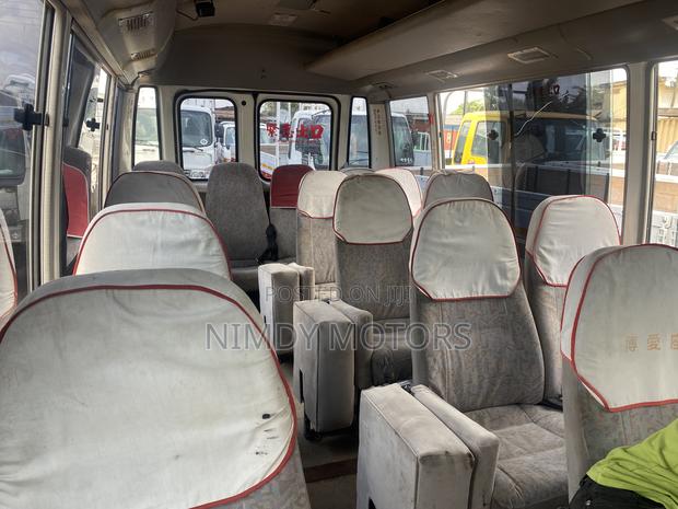 Toyota Coaster 2014 Yellow photo 5