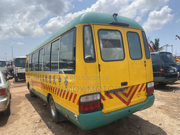 Toyota Coaster 2014 Yellow photo 4