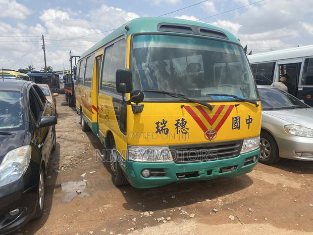 Toyota Coaster 2014 Yellow photo 2
