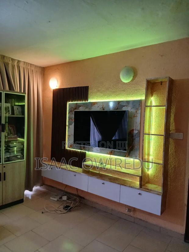 Television Wall Mounted Design With Panel And Lighting System · Photo 2