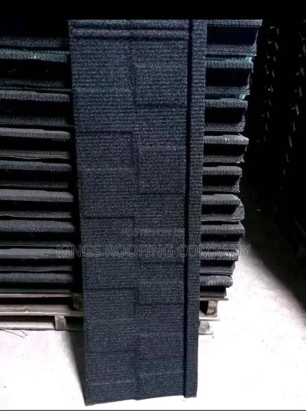 Packed Black Shingle Roofing · Photo 2