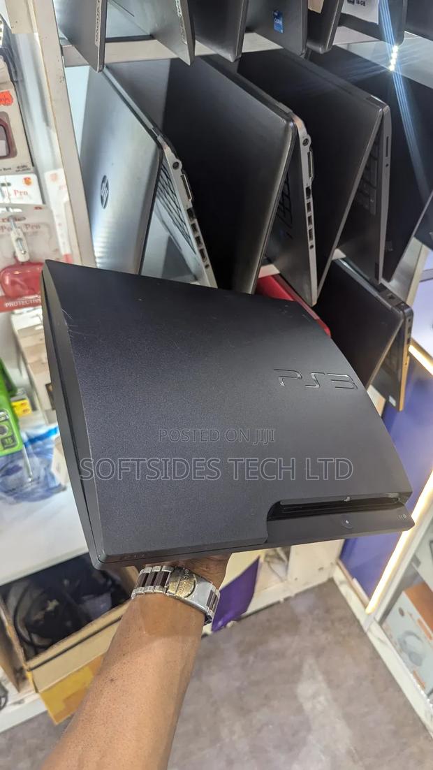 A Black Playstation 3 Slim With Games for Sale in Accra photo 3