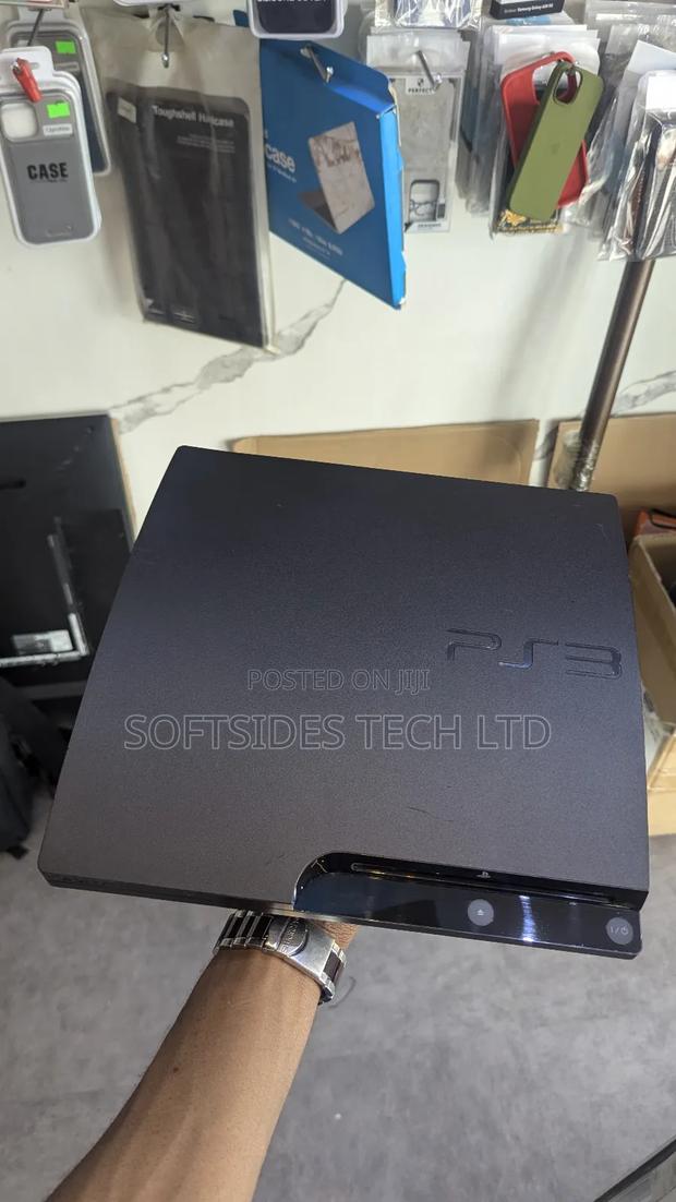 A Black Playstation 3 Slim With Games for Sale in Accra photo 4