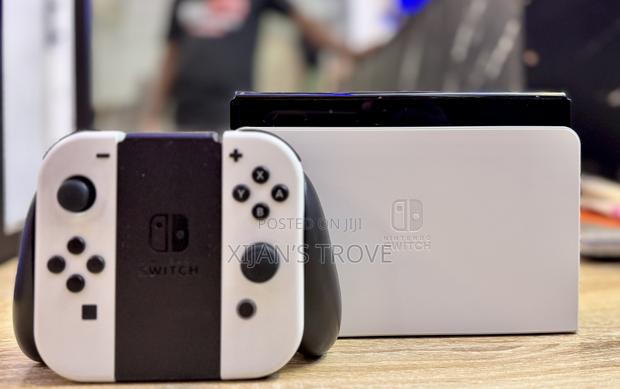 Nintendo Switch Oled - White With All Accessories and Two Games. photo 2