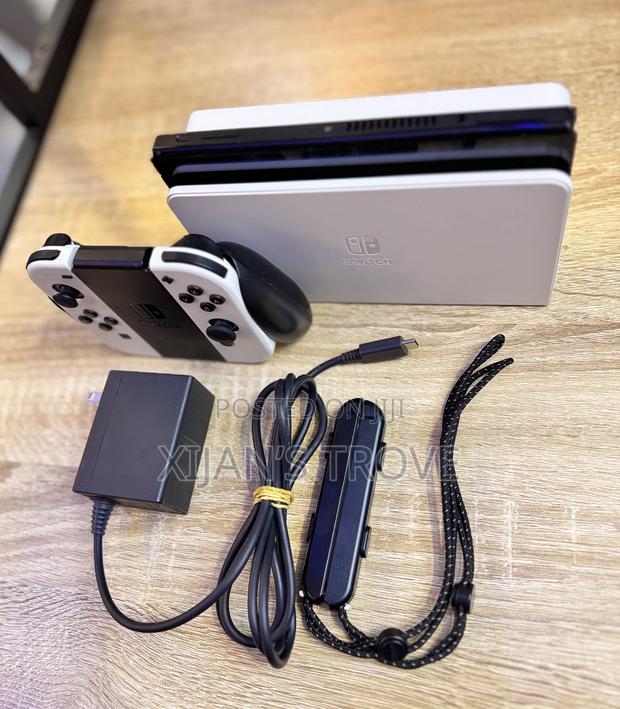 Nintendo Switch Oled - White With All Accessories and Two Games. photo 4
