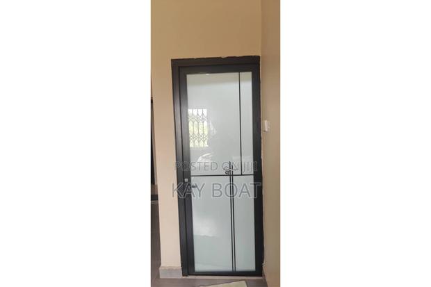 An Installed Washroom Door · Photo 2