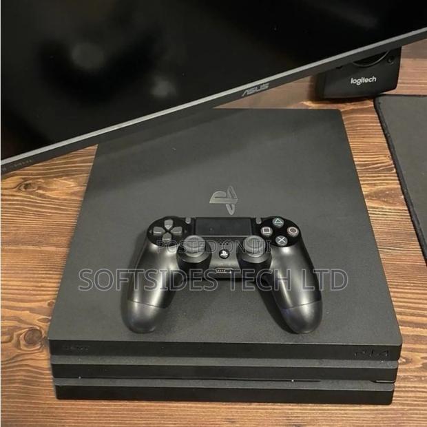 Black Sony Ps4 Pro or Playstation 4 Pro With 15 Hot Games Installed photo 2