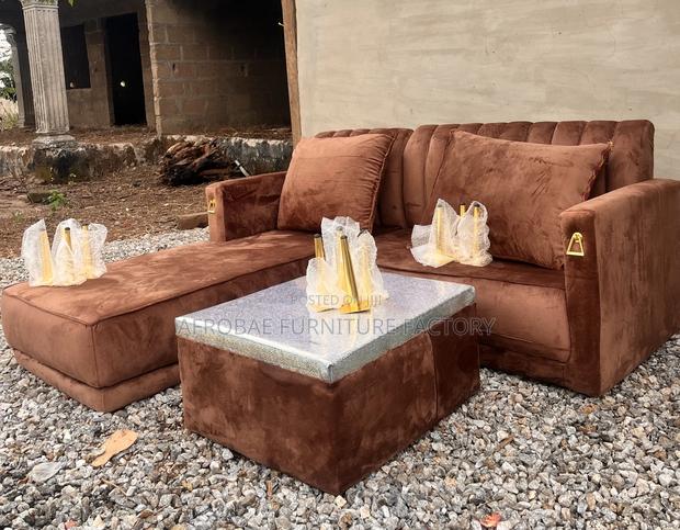 L - Shaped Sofa Chair With Quality Pillows and Polished Center Table · Photo 2