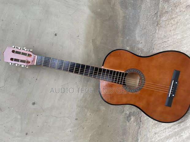 Brown Acoustic Guitar · Photo 1