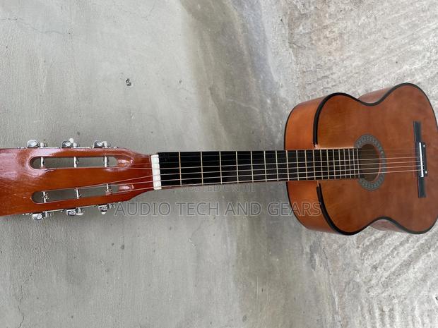 Brown Acoustic Guitar · Photo 2