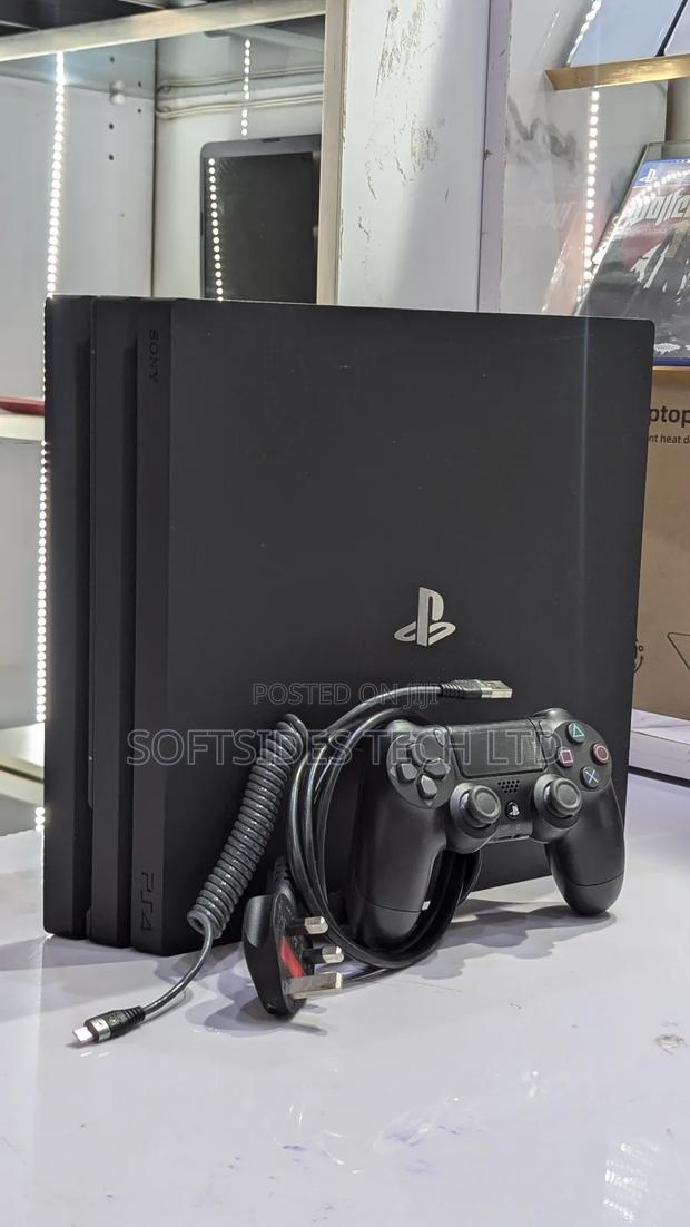 Very Neat Playstation 4 Pro With 15 Games and Accessories Shop Tested.