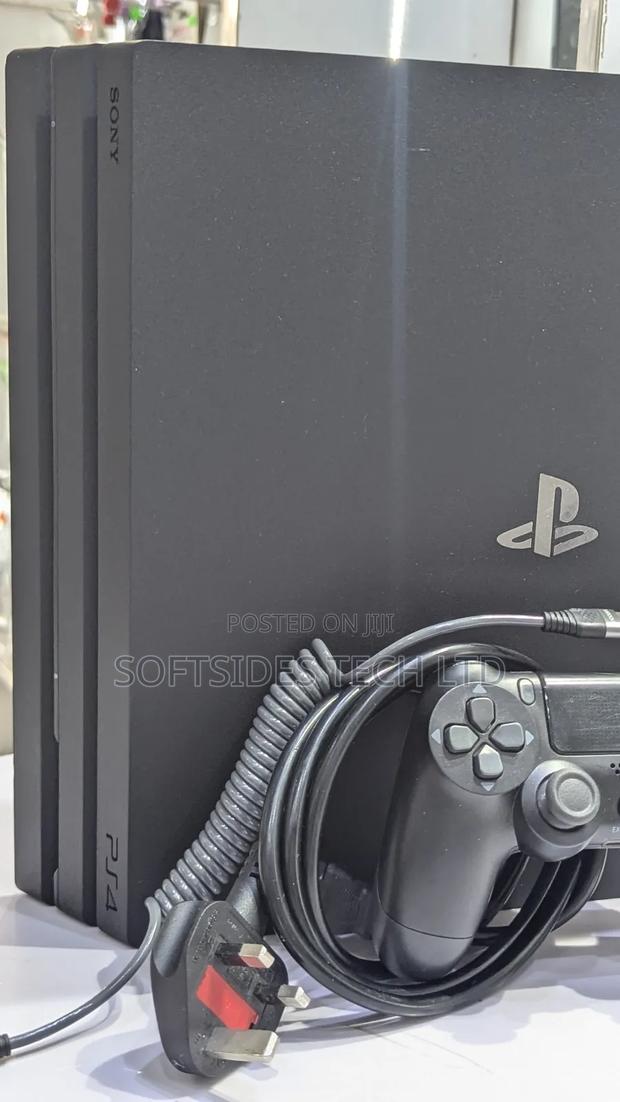 Very Neat Playstation 4 Pro With 15 Games and Accessories Shop Tested. photo 2
