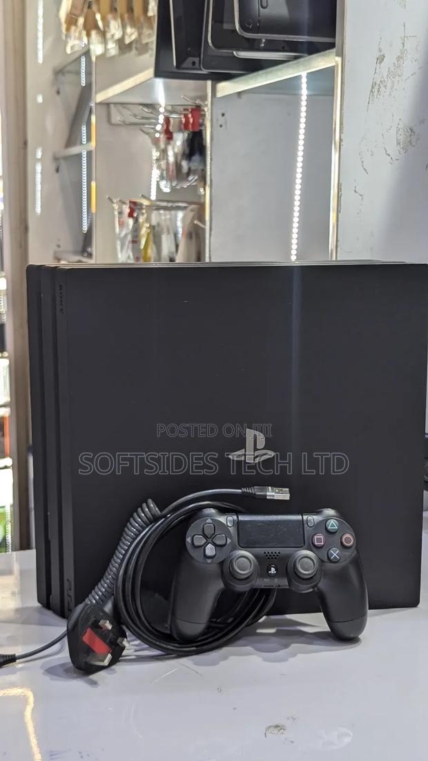Very Neat Playstation 4 Pro With 15 Games and Accessories Shop Tested. photo 4