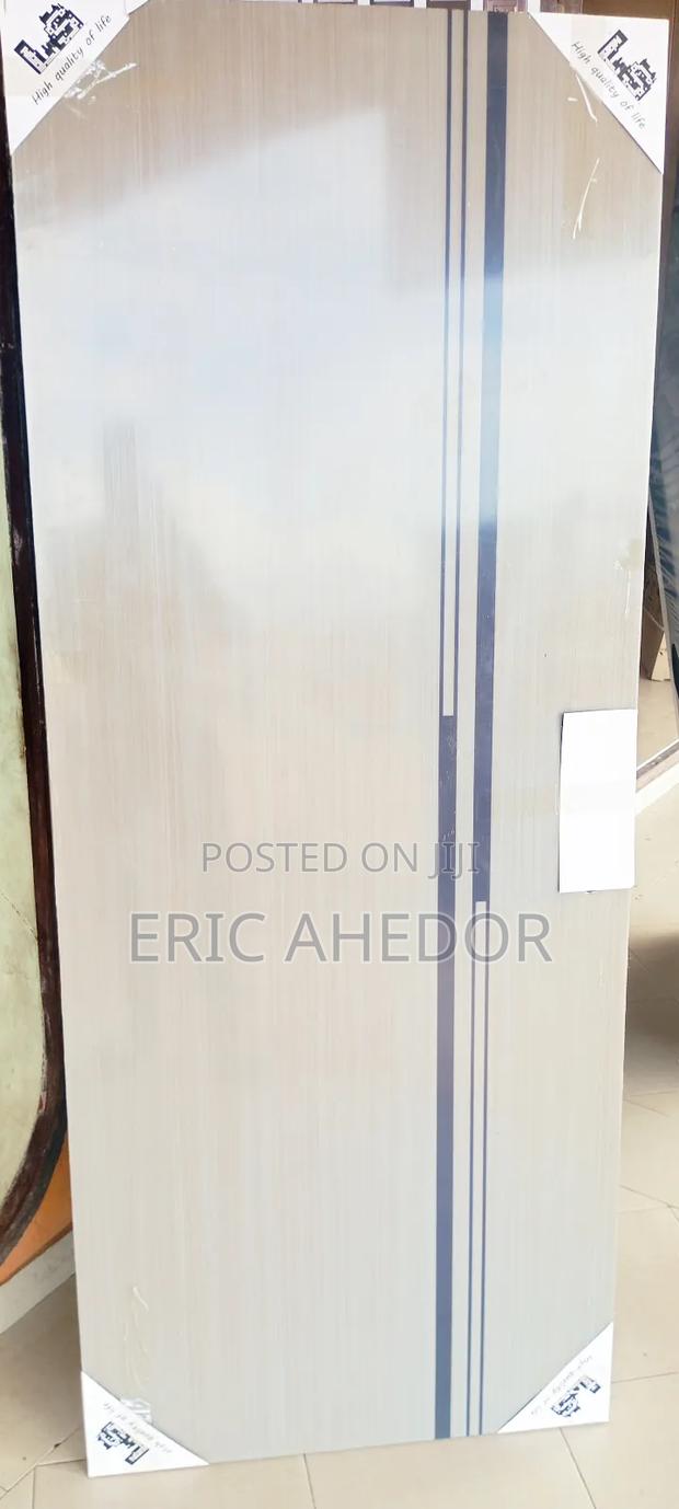 Smooth Wooden Door With Metal Frame and Handle