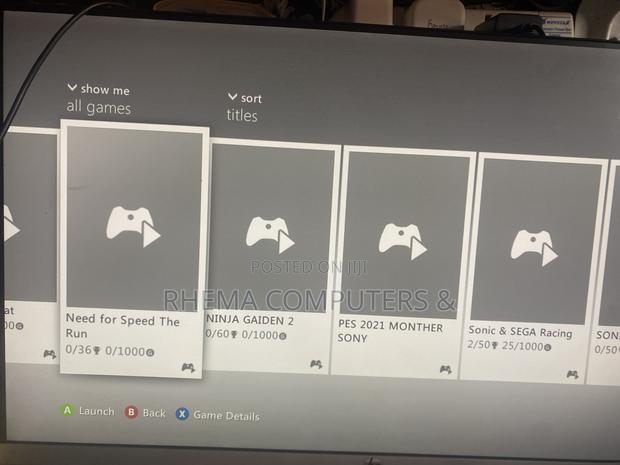 Xbox 360 Slim With 9 Games and a Controller photo 5