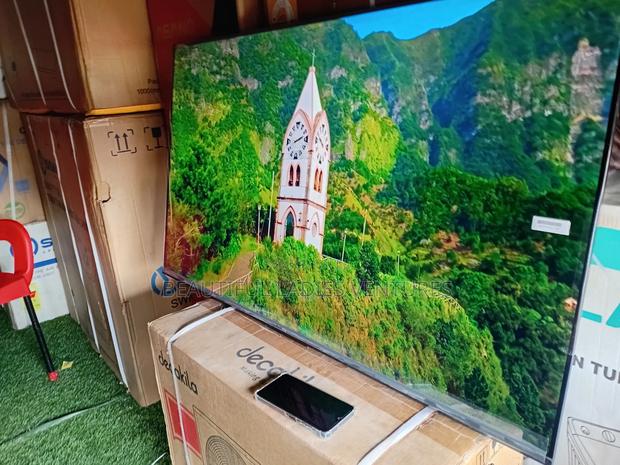 Attentive TCL 50inches Colossal Smart Tv Fat Cat TCL Tv · Photo 3