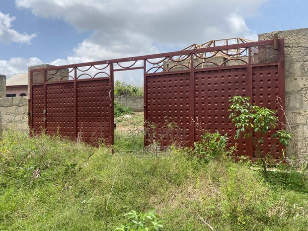 Gated Land With an Uncompleted Story Building at Domeabra Near Knust photo 9