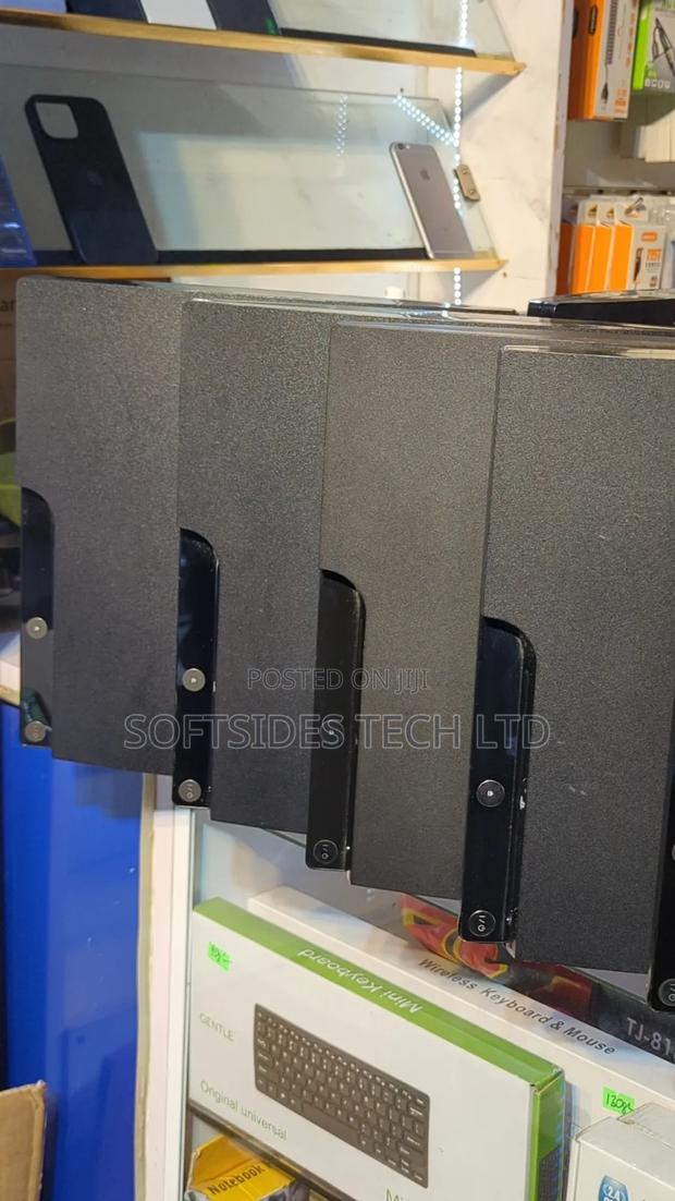 Black Playstation 3 Slim Cute Version With Games and a Controller photo 3