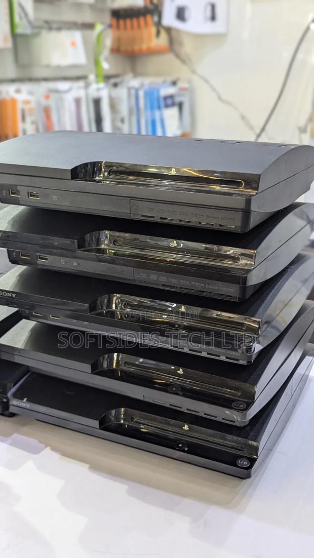 Black Playstation 3 Slim Cute Version With Games and a Controller photo 2