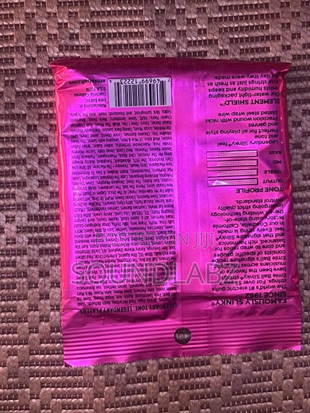 Ernie Ball Super Slinky Custom Gauge Electric Guitar Strings. · Photo 4