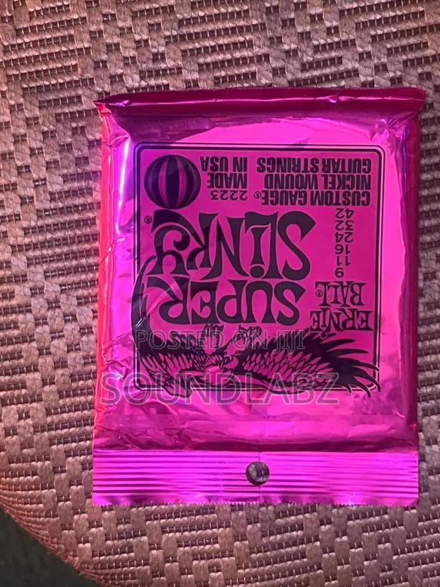 Ernie Ball Super Slinky Custom Gauge Electric Guitar Strings. · Photo 3