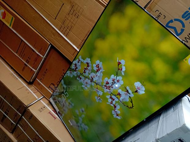 Big Screen 55-Inch Smart Television With Resolution for Realistic · Photo 4