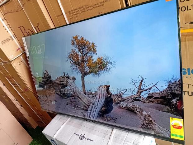 Sleek and Slim 55-Inch Smart Tv for Stylish Modern Living Spaces · Photo 3