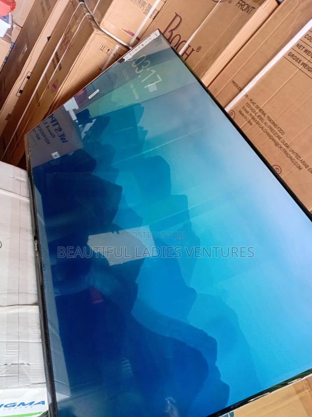 Sleek and Slim 55-Inch Smart Tv for Stylish Modern Living Spaces · Photo 4