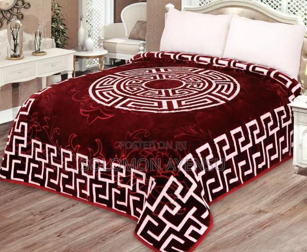 Quality Korean Mink Blanket With a Blue and White Greek Key Pattern.