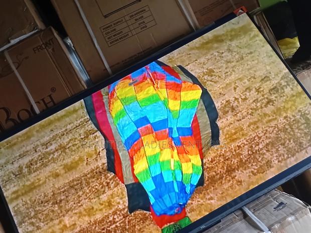 55-Inch Smart Tv Offering High-Definition Visuals and Wi-Fi Access · Photo 4