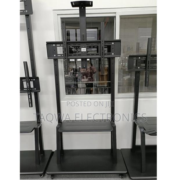 More- Thicker—32-75 “ Universal Mobile Tv Stand · Photo 2