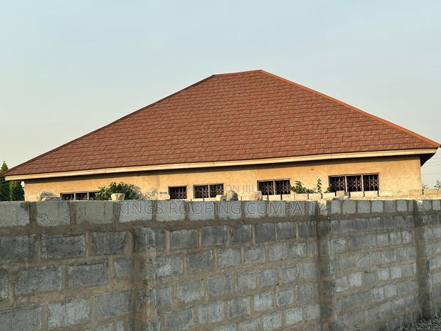 Aesthetically Pleasing Brown Shingle Roofing · Photo 2