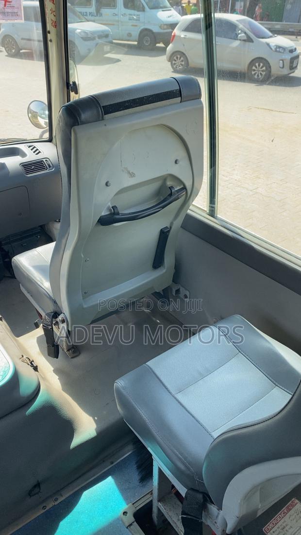 Toyota Coaster 2013 Yellow photo 4