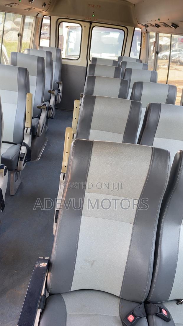 Toyota Coaster 2013 Yellow photo 2