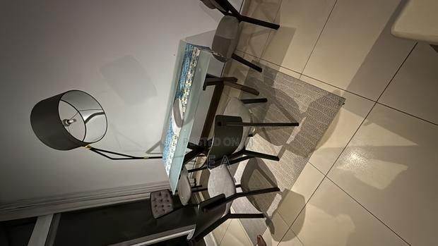 Modern Glass-Top Dining Table With 4 Chairs