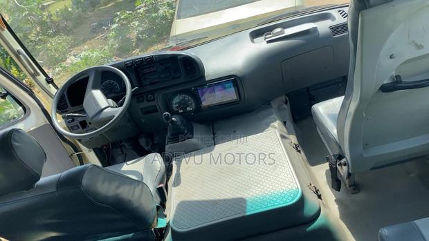 Toyota Coaster 2013 Yellow photo 6