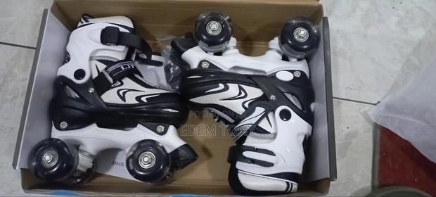 A Pair Of Ljpymx Quad Roller Skates For Small Kids
