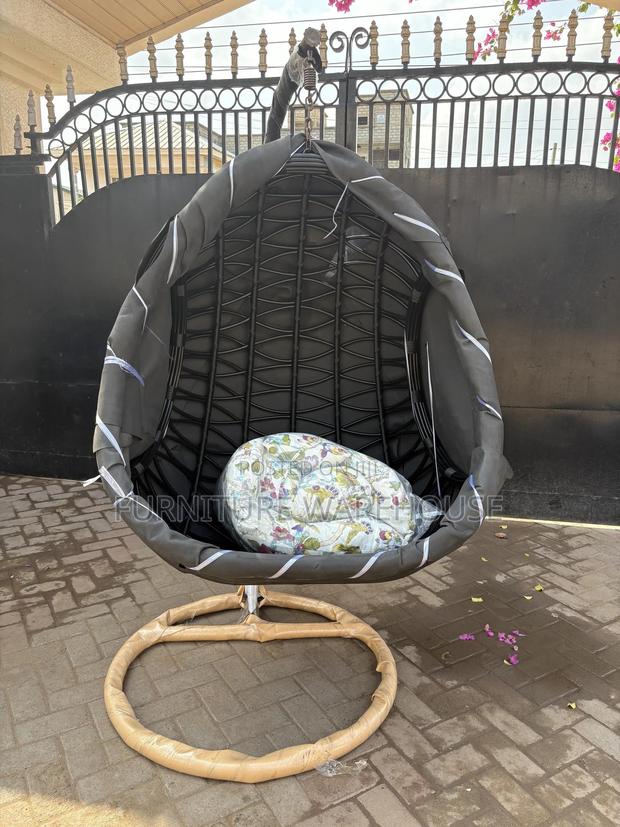 Rattan Hanging Egg Chair With A Floral Cushion photo 4