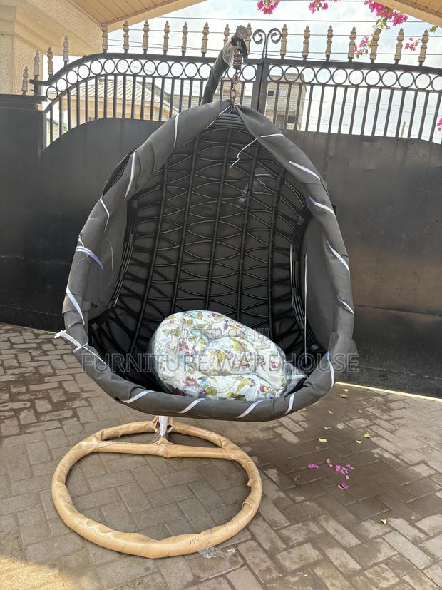 Rattan Hanging Egg Chair With A Floral Cushion photo 2