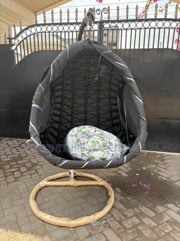 Rattan Hanging Egg Chair With A Floral Cushion photo 3