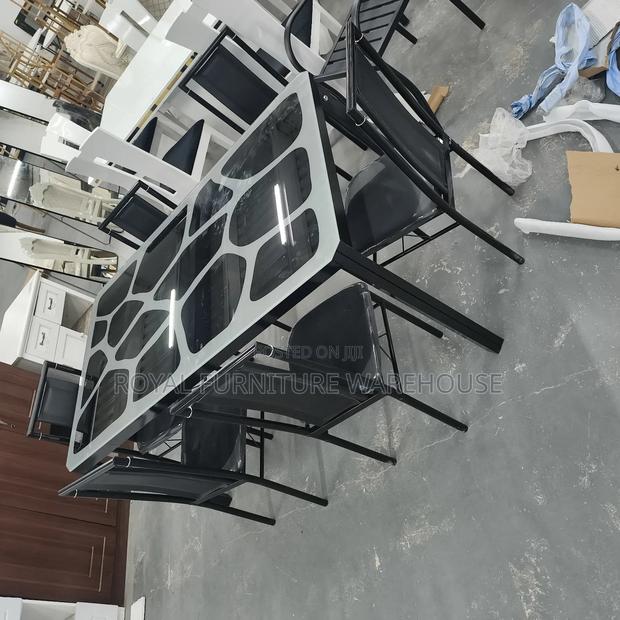 Modern Metal and Glass Dining Table Set With Six Black Chairs